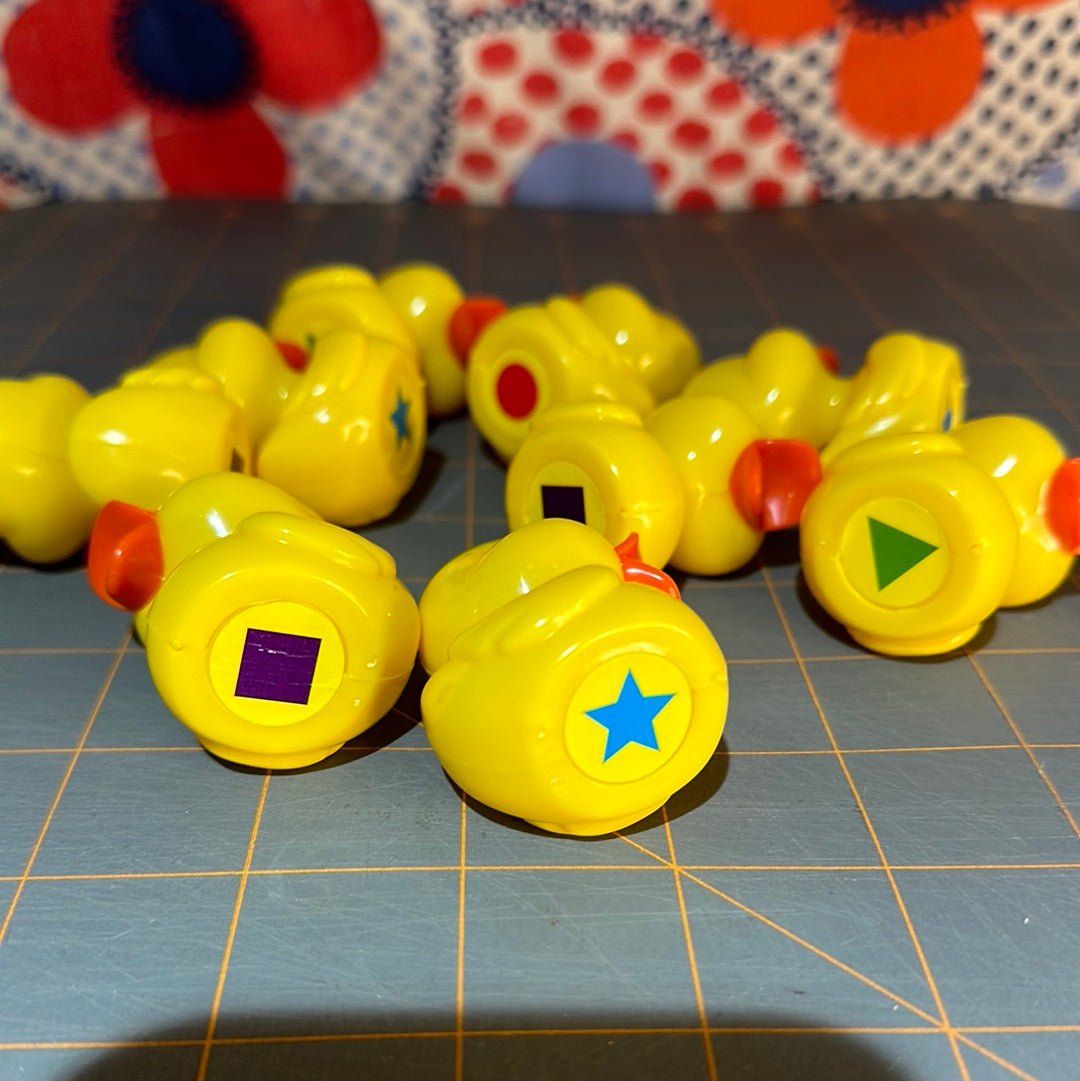 Lot of 9 Plastic Ducks with Memory Shapes on bottom, 2"